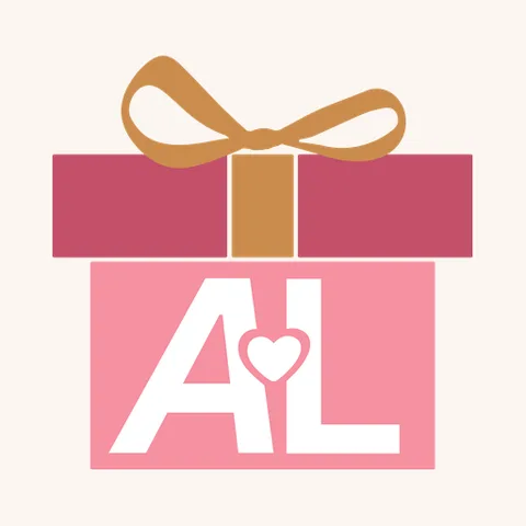 The Anniversary Leaderboard badge: a wrapped gift box with a bow, lettered A and L with a heart between them.